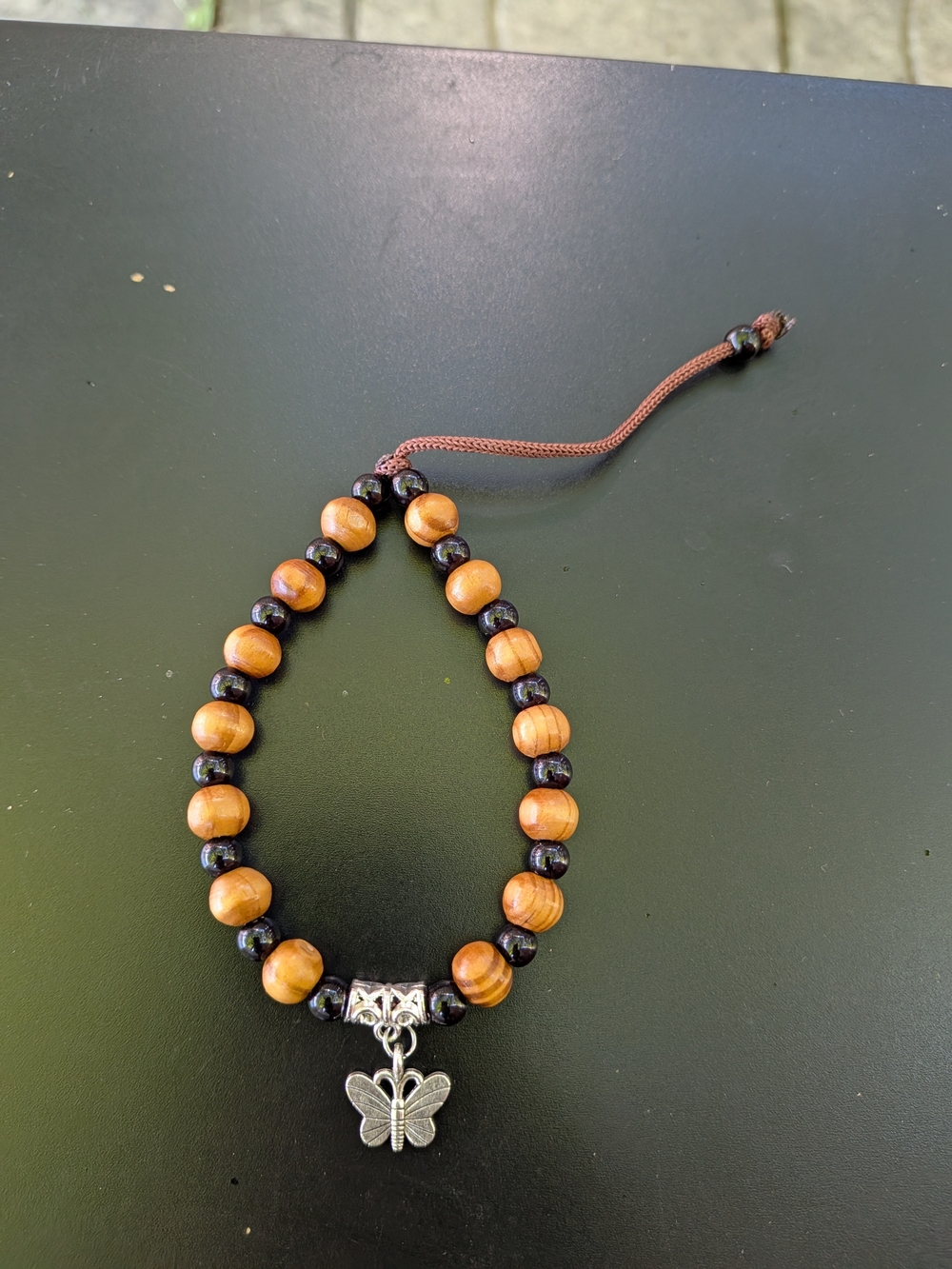 Handcrafted Brown & Black Beaded Bracelet with Silver Butterfly Charm